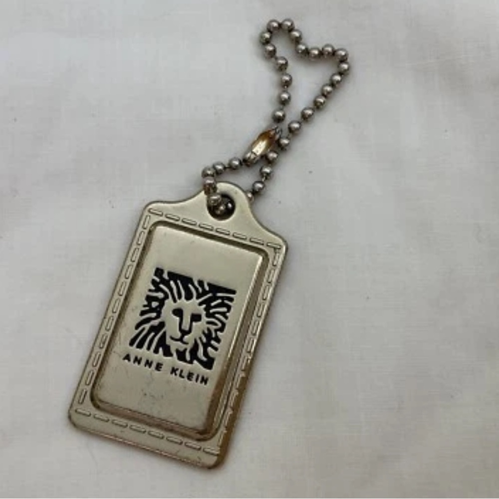 Anne Klein Tag Gold Tone Lion approx 2.25” x 1.25”